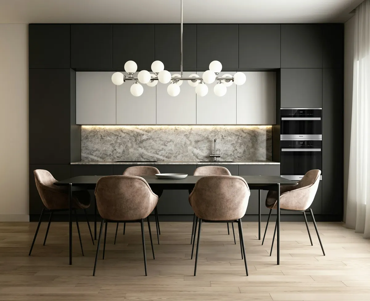 Modern black kitchen renovation in Sydney with stone splashback, integrated appliances and a dining table under globe pendant lights